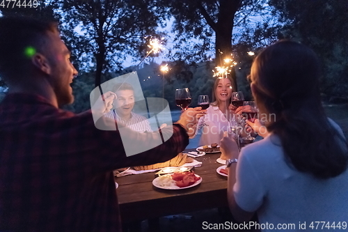 Image of french dinner party on summer