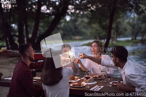 Image of french dinner party on summer