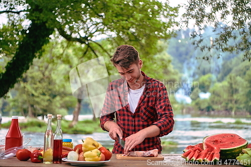 Image of man cooking tasty food for french dinner party