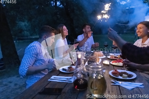 Image of french dinner party on summer