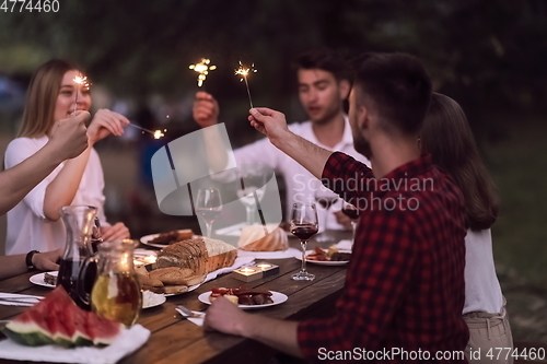 Image of french dinner party on summer