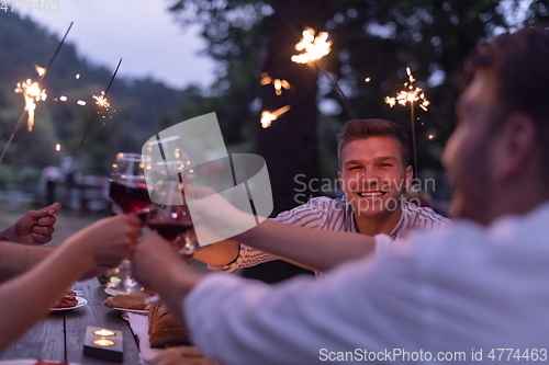 Image of french dinner party on summer