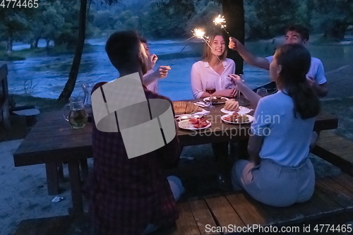 Image of french dinner party on summer