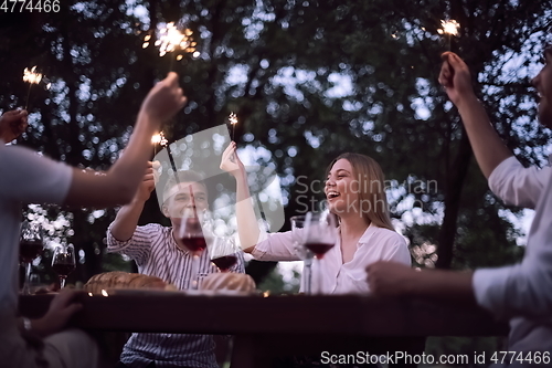 Image of french dinner party on summer