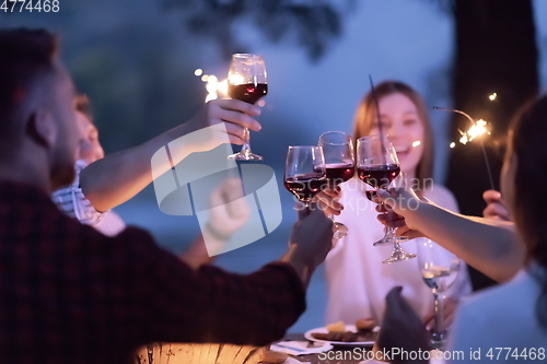 Image of french dinner party on summer