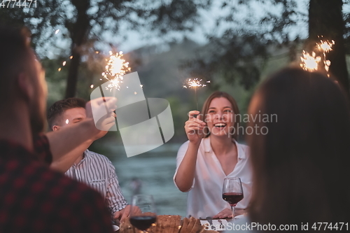 Image of french dinner party on summer