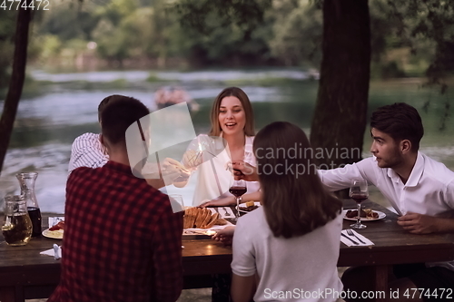 Image of french dinner party on summer