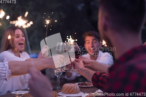 Image of french dinner party on summer