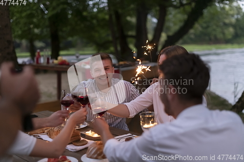 Image of french dinner party on summer