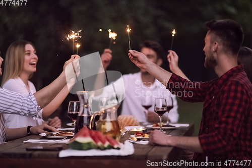 Image of french dinner party on summer