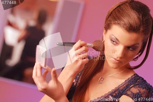 Image of A woman during the making-up