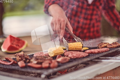 Image of man cooking tasty food for french dinner party