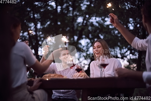 Image of french dinner party on summer