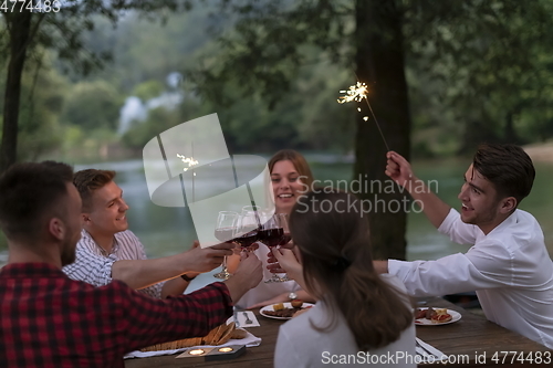 Image of french dinner party on summer