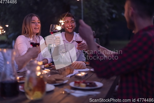 Image of french dinner party on summer