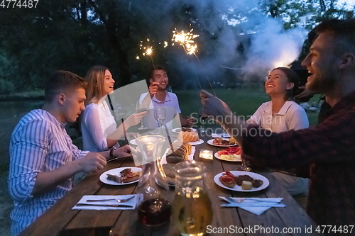 Image of french dinner party on summer