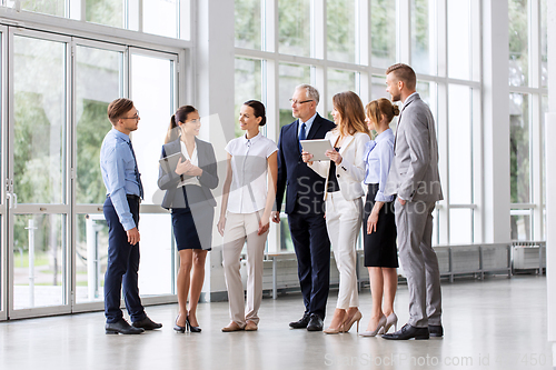 Image of business people with tablet pc computers at office