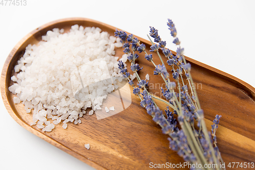 Image of sea salt heap and lavender on wooden tray