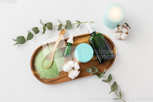 Image of bath salt, serum, moisturizer and oil on tray