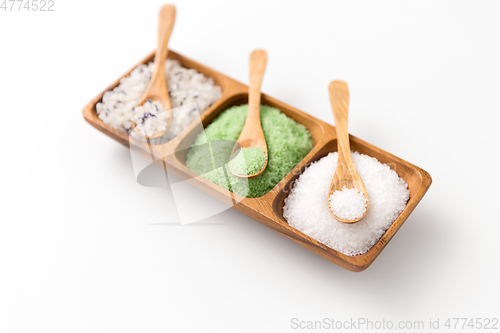 Image of sea salt and spoons on wooden tray