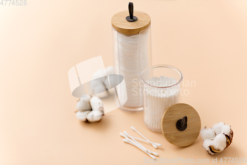 Image of white cotton pads and swabs in holders