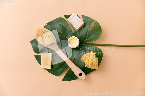 Image of natural soap, brush, sponge and body butter