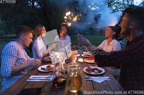 Image of french dinner party on summer