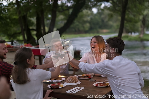 Image of french dinner party on summer