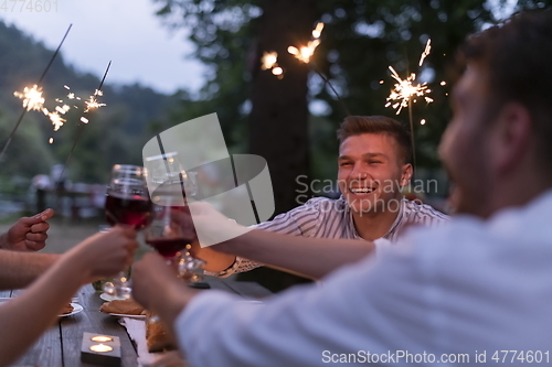 Image of french dinner party on summer