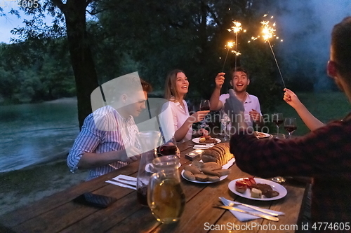 Image of french dinner party on summer