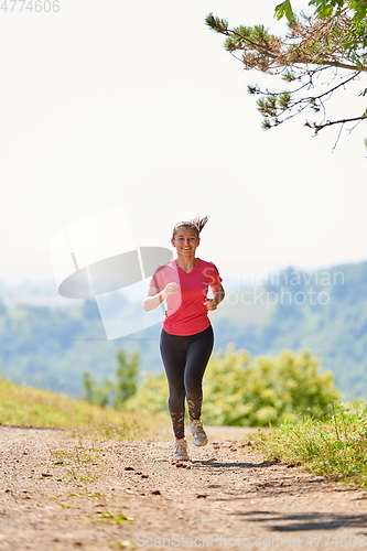 Image of woman enjoying in a healthy lifestyle while jogging