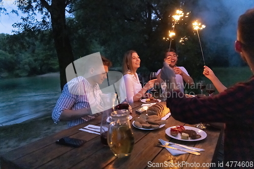 Image of french dinner party on summer