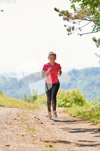 Image of woman enjoying in a healthy lifestyle while jogging