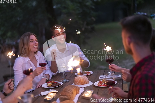 Image of french dinner party on summer