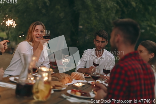 Image of french dinner party on summer