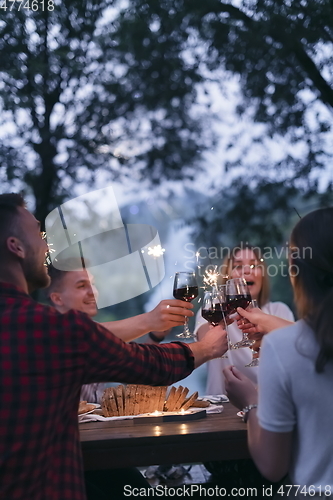 Image of french dinner party on summer