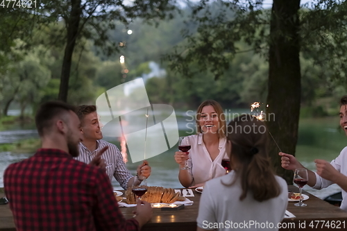 Image of french dinner party on summer