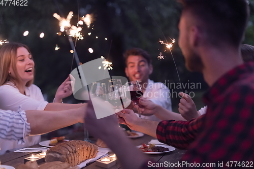 Image of french dinner party on summer