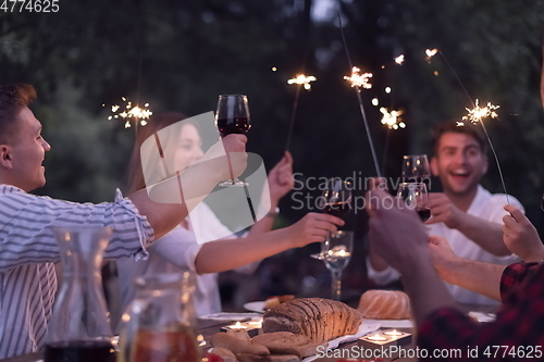 Image of french dinner party on summer