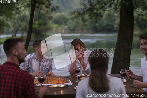 Image of french dinner party on summer