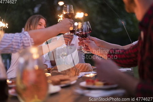 Image of french dinner party on summer