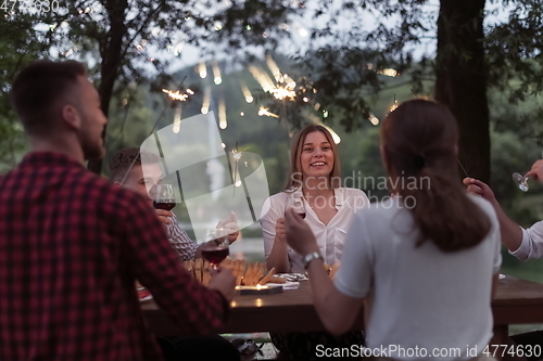 Image of french dinner party on summer