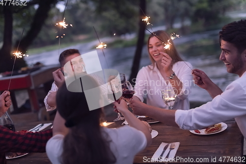 Image of french dinner party on summer