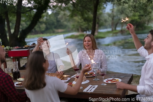 Image of french dinner party on summer