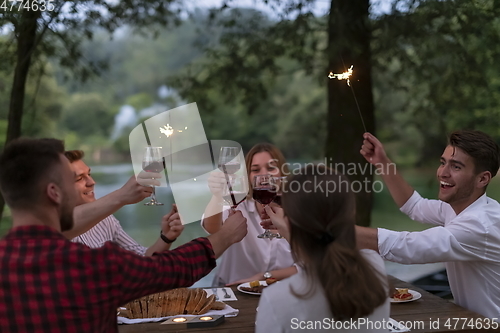 Image of french dinner party on summer