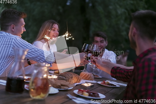 Image of french dinner party on summer