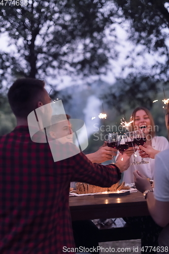 Image of french dinner party on summer