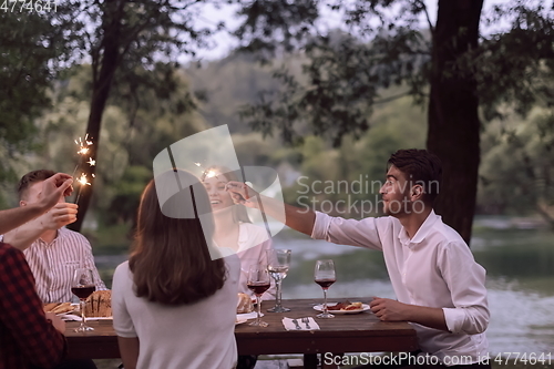 Image of french dinner party on summer