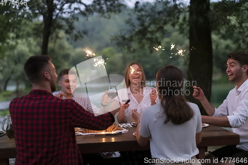 Image of french dinner party on summer