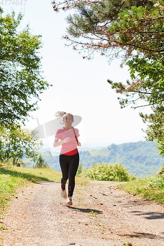 Image of woman enjoying in a healthy lifestyle while jogging